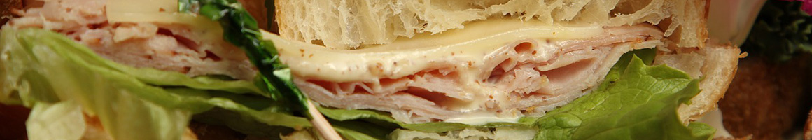 Eating Deli Pizza Sandwich at Italian Groceria Medfield restaurant in Medfield, MA.